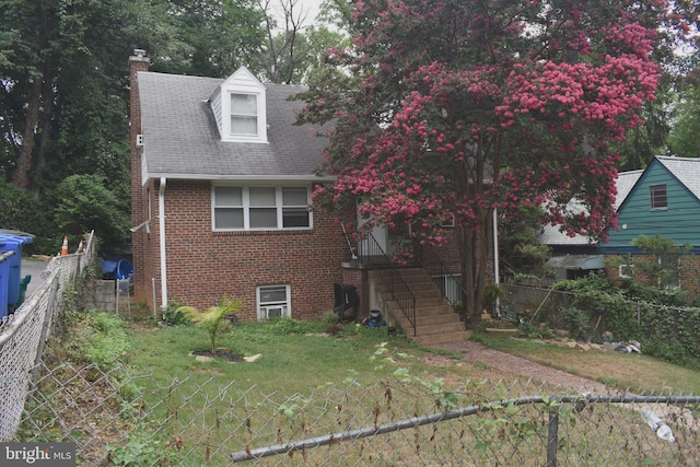 view of front of home featuring a front yard