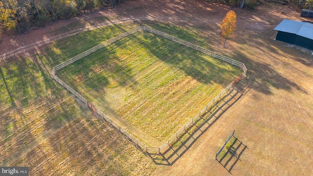 birds eye view of property with a rural view