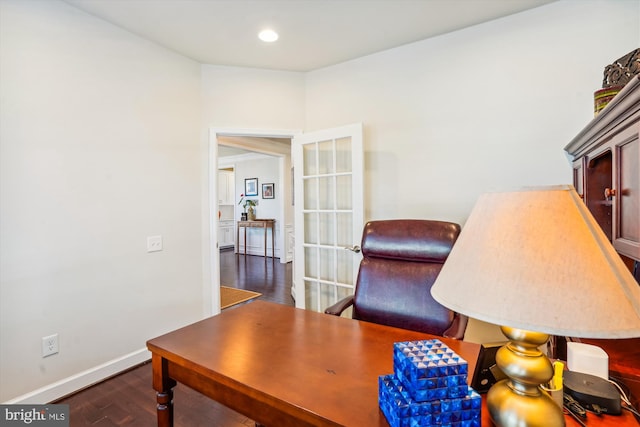 home office with dark wood-type flooring