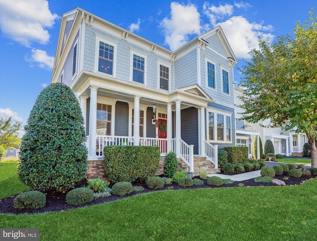 view of front facade with a porch and a front lawn