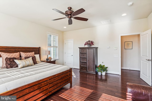 bedroom featuring dark hardwood / wood-style floors and ceiling fan