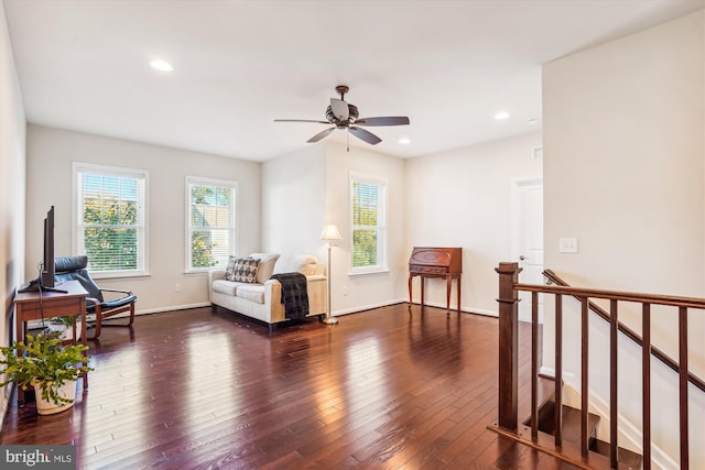 sitting room featuring ceiling fan and dark hardwood / wood-style flooring