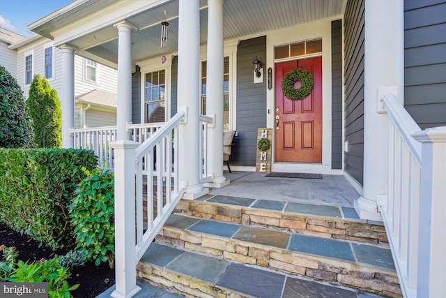 property entrance featuring a porch