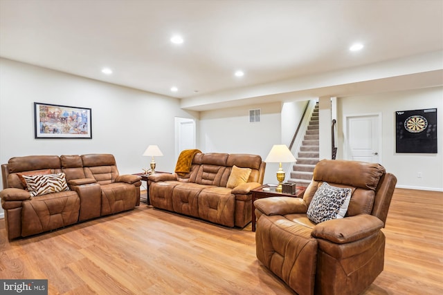 living room with light hardwood / wood-style flooring