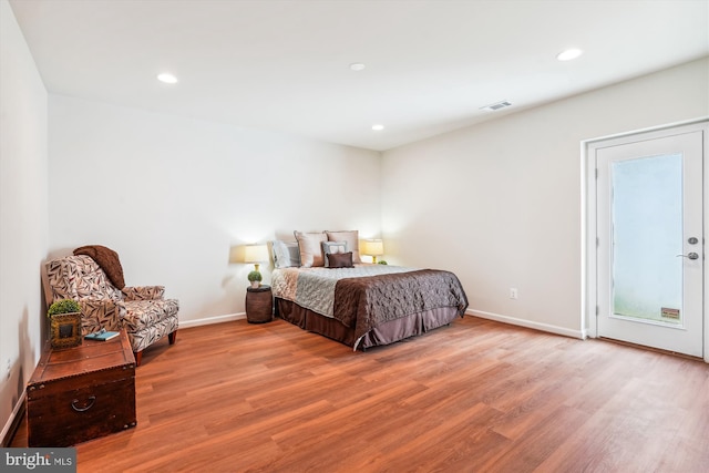 bedroom with light hardwood / wood-style floors