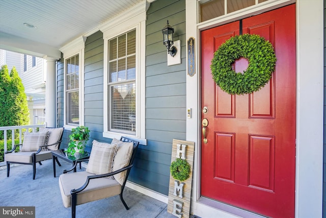 property entrance featuring covered porch