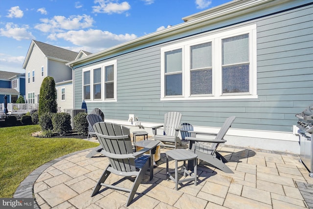 back of property featuring a yard and a patio area