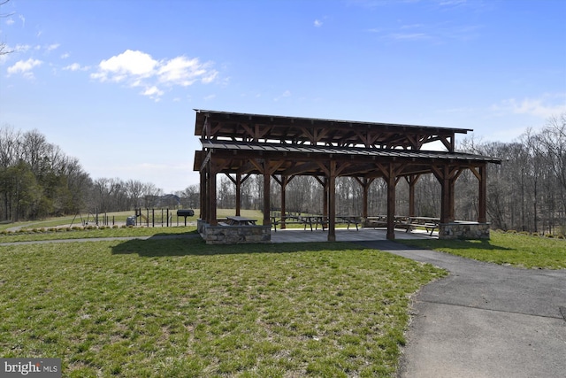 view of property's community with a lawn