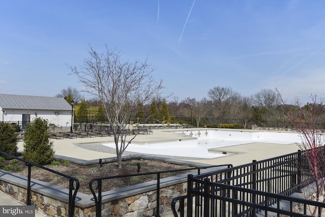 view of yard featuring a patio and a covered pool