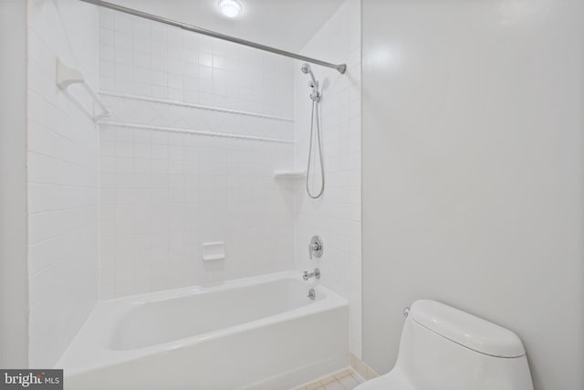 bathroom with shower / washtub combination and toilet