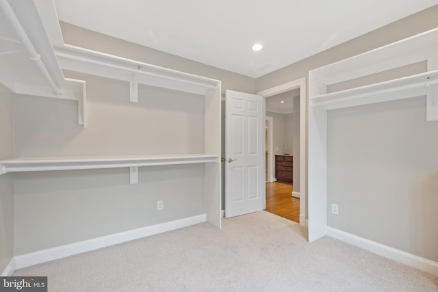 interior space with carpet, baseboards, and recessed lighting