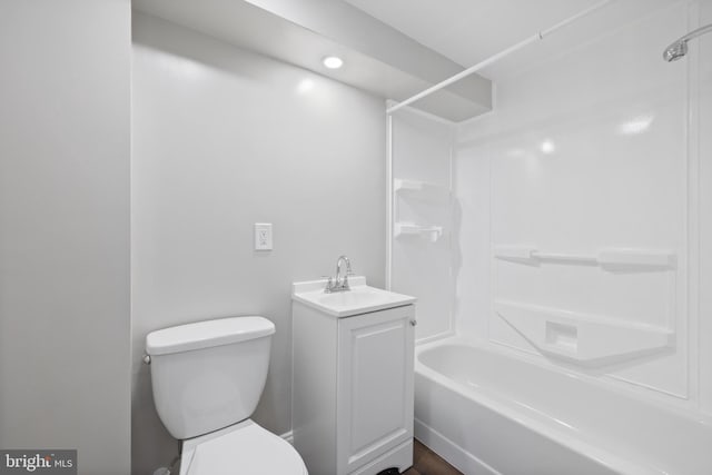 bathroom with shower / bathing tub combination, vanity, and toilet