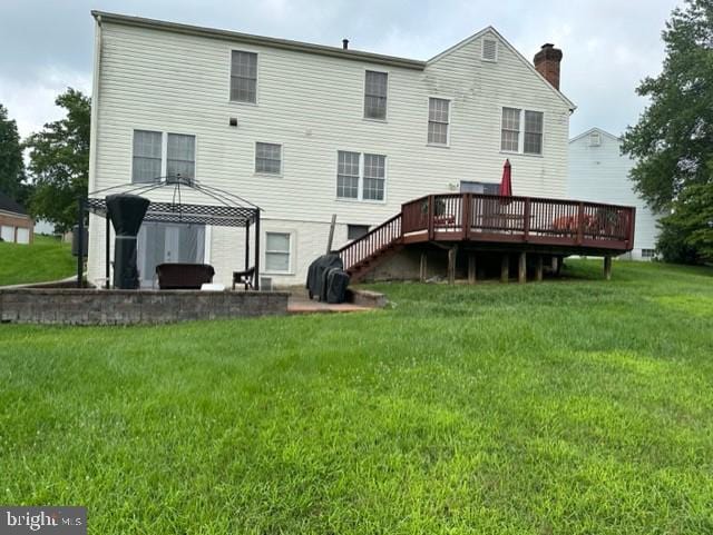 back of house with a gazebo, a yard, a deck, and a patio area