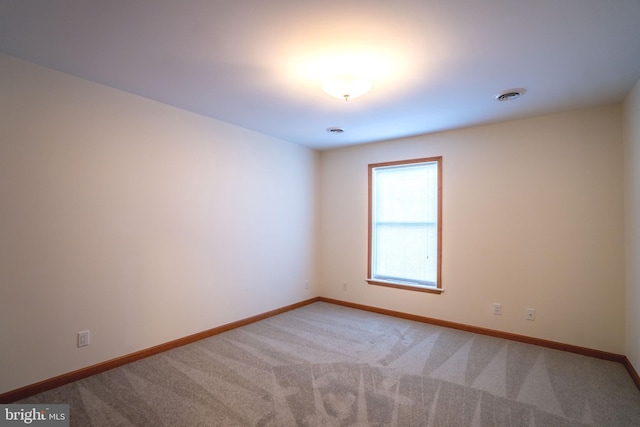 unfurnished room with carpet floors