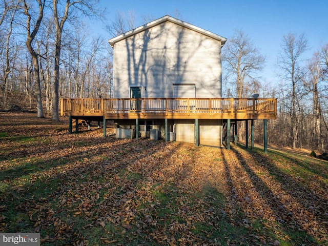 rear view of property featuring a deck