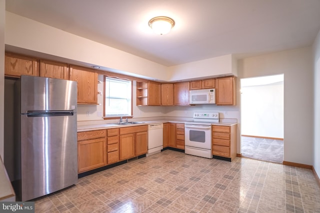 kitchen with white appliances and sink