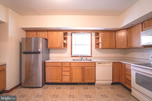 kitchen with white appliances and sink