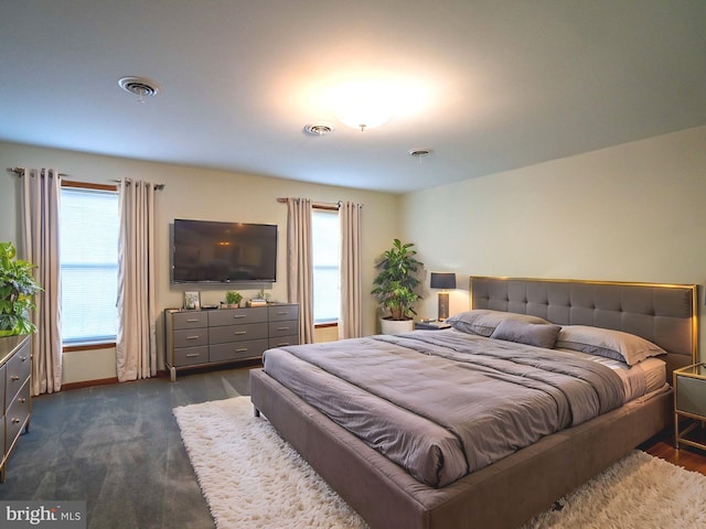 bedroom featuring multiple windows