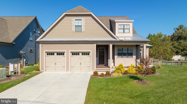 view of front of house with a front lawn and a garage