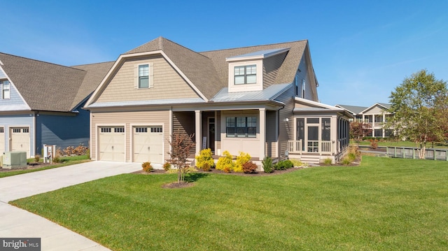 craftsman inspired home with central air condition unit, a garage, and a front lawn