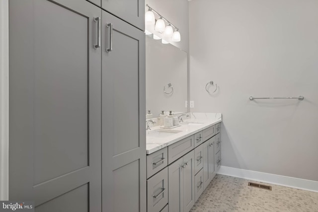 bathroom featuring tile patterned flooring and vanity