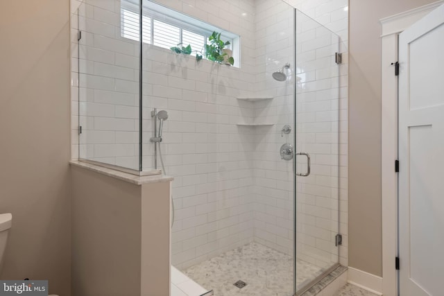 bathroom with an enclosed shower