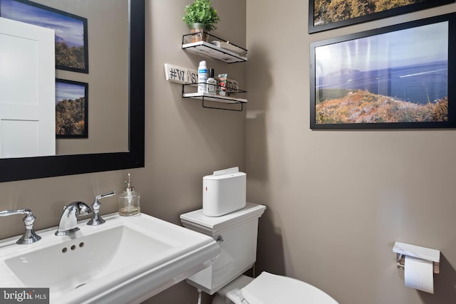 bathroom with sink and toilet