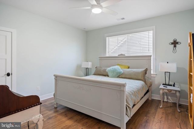 bedroom featuring dark wood-type flooring and ceiling fan