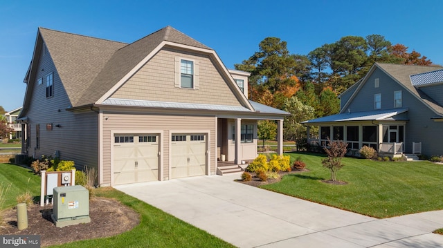 view of front of home with a front lawn and a garage