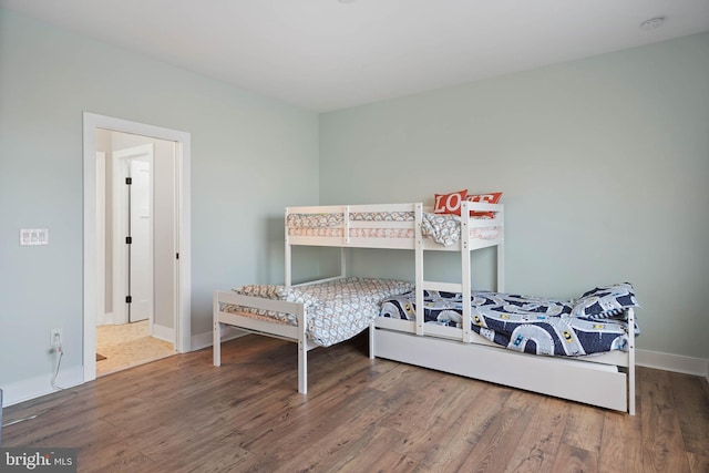 bedroom featuring wood-type flooring