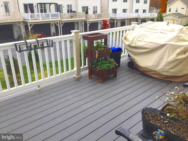 wooden terrace featuring area for grilling