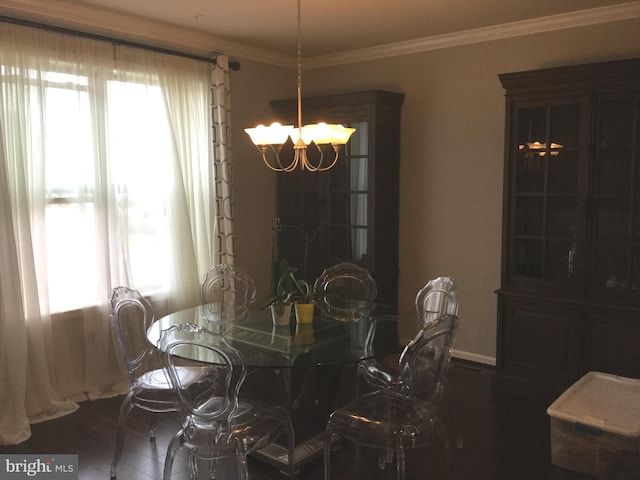 dining room with crown molding, a chandelier, and dark hardwood / wood-style floors