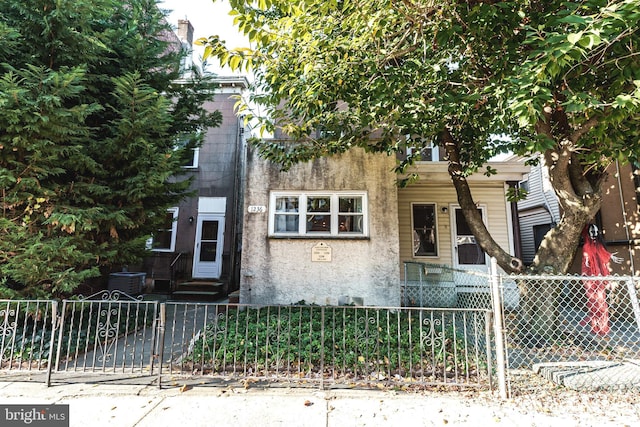 view of front of home featuring central air condition unit