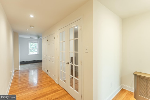 hallway featuring light hardwood / wood-style flooring