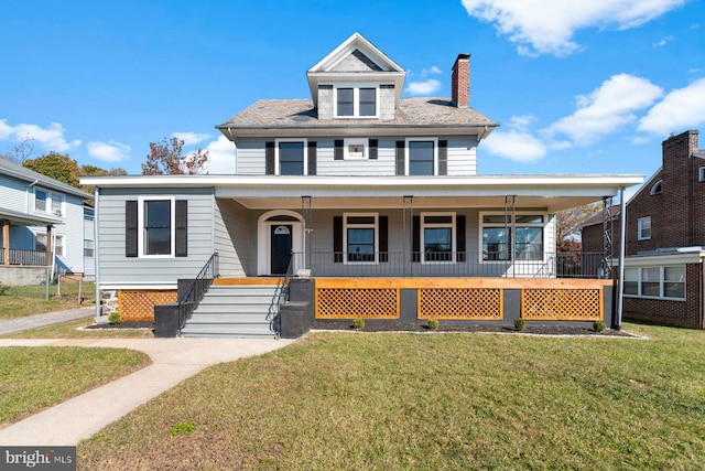 view of front of home with a porch and a front lawn