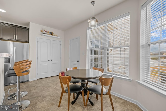 dining area featuring a healthy amount of sunlight