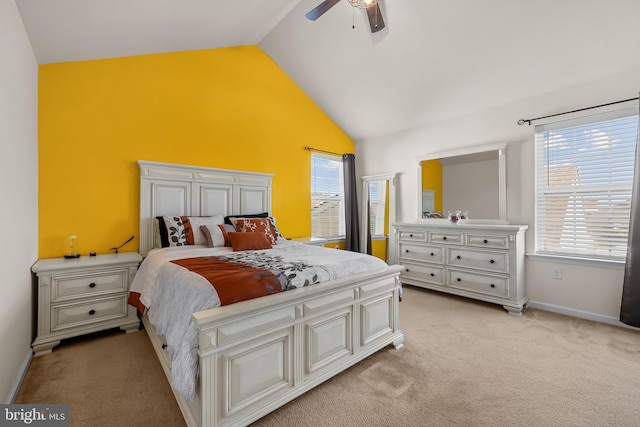 bedroom featuring lofted ceiling, light carpet, multiple windows, and ceiling fan