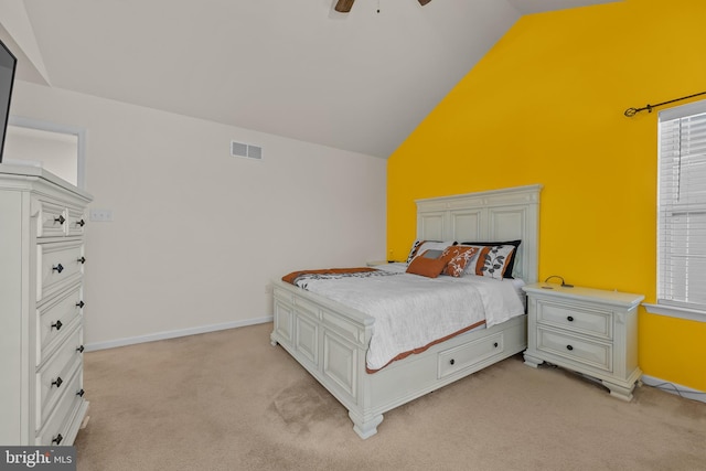 bedroom featuring ceiling fan, high vaulted ceiling, and light colored carpet