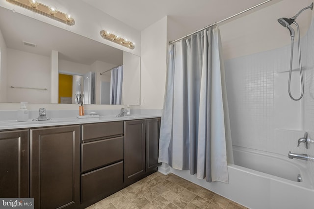 bathroom featuring vanity and shower / tub combo with curtain