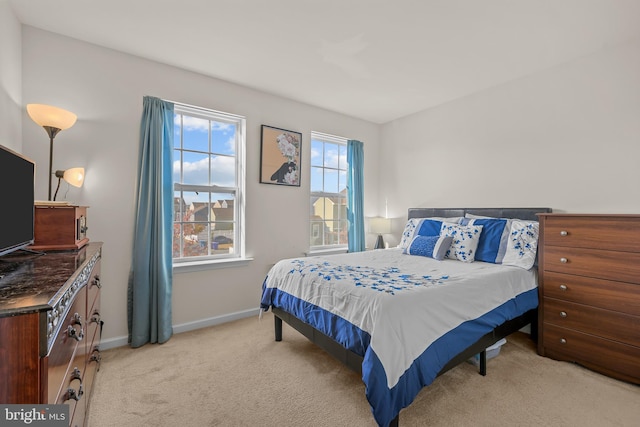 bedroom with light carpet