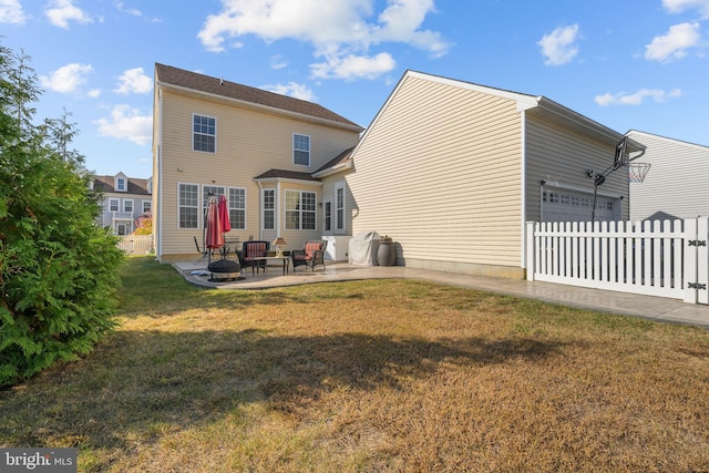 rear view of property with a patio and a yard