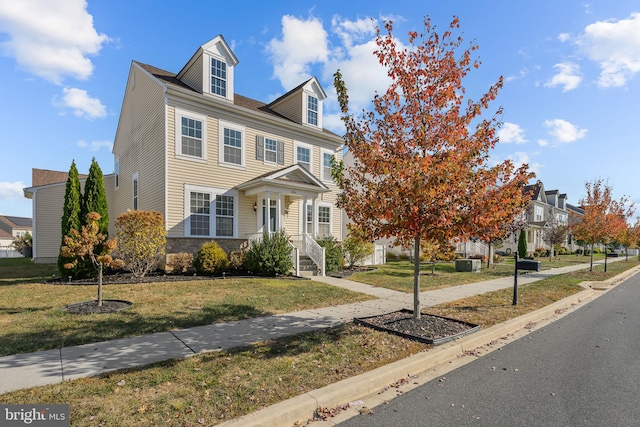 view of front of property featuring a front lawn