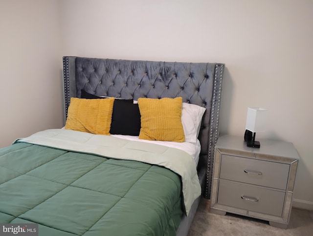 bedroom with light colored carpet