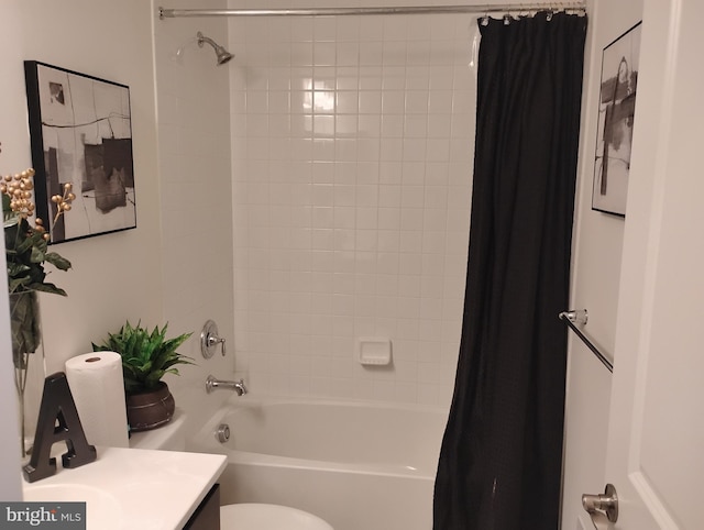 full bathroom with vanity, shower / bath combo, and toilet