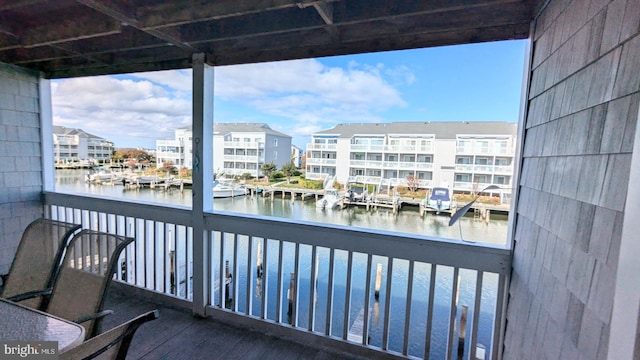 balcony featuring a water view