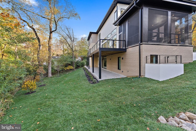 view of yard with a patio and a sunroom