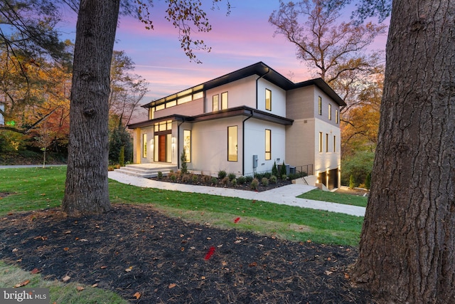 modern home with a lawn