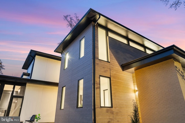 view of property exterior at dusk