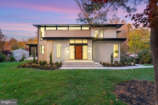 view of front of house with a lawn