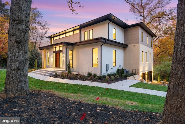 contemporary home featuring a yard